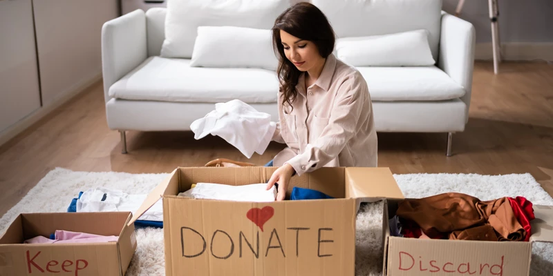 decluttering boxes, sell, donate, keep, discard